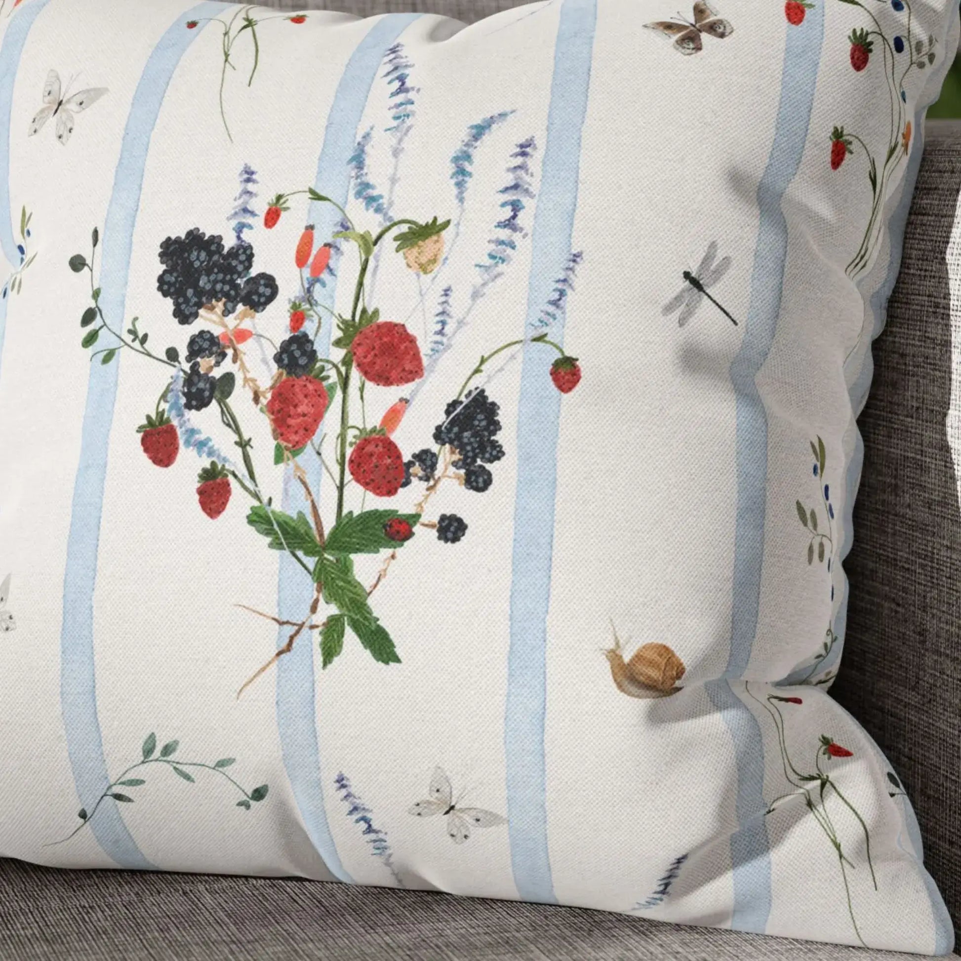 Watercolor Berry Botanical Pillow featuring watercolor strawberries and blackberries on soft blue striped background.