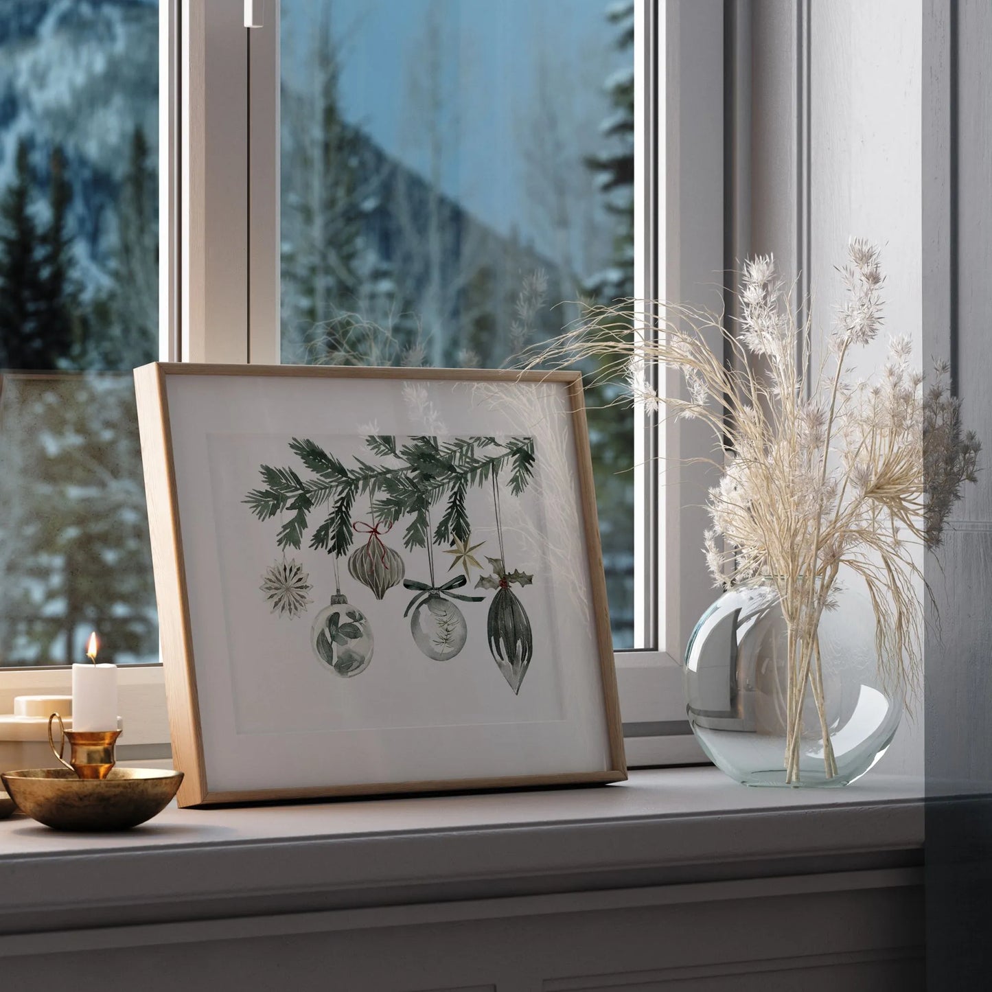 Watercolor Ornaments Christmas Print Art displayed on window sill alongside a decorative vase and candle.