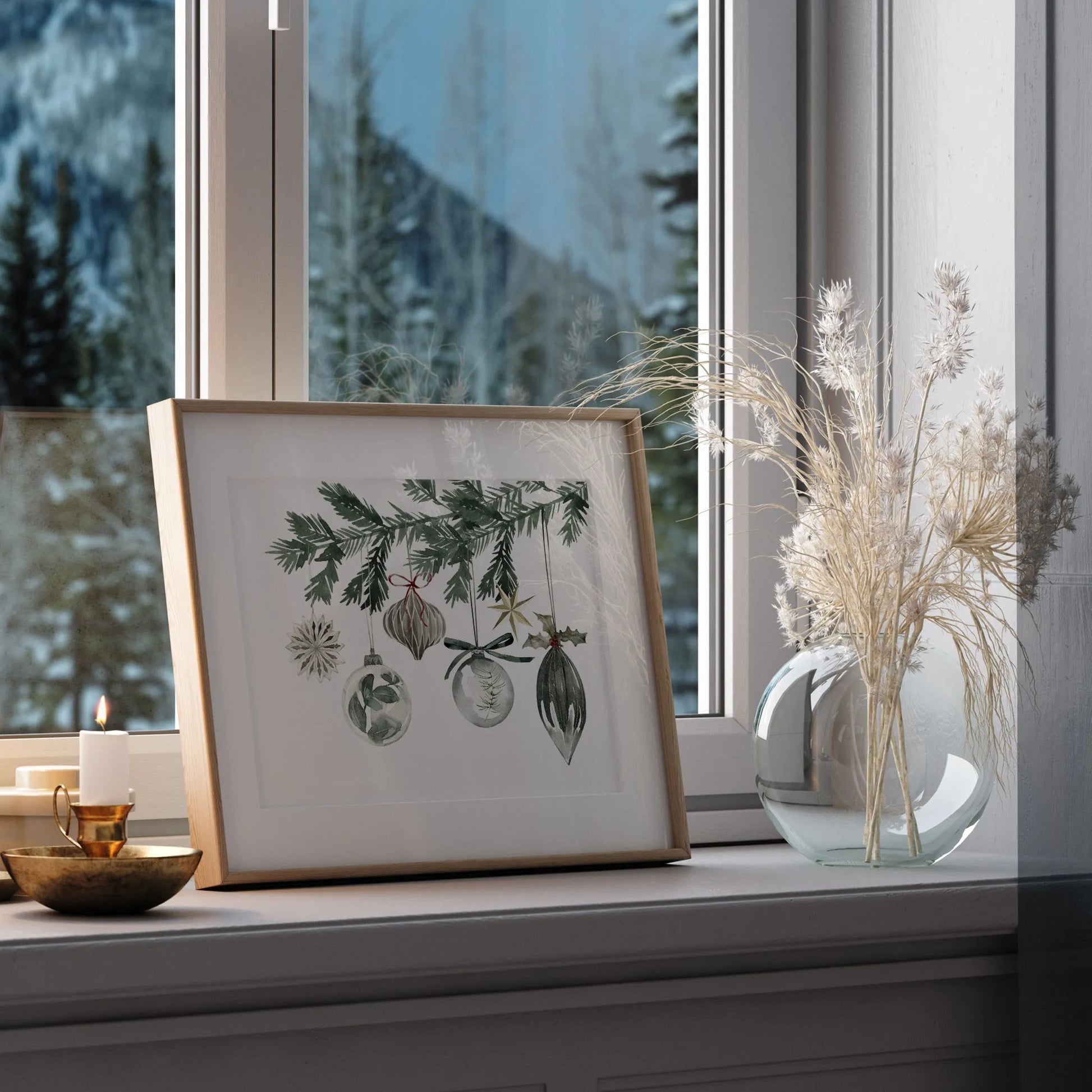Watercolor Ornaments Christmas Print Art displayed on window sill alongside a decorative vase and candle.