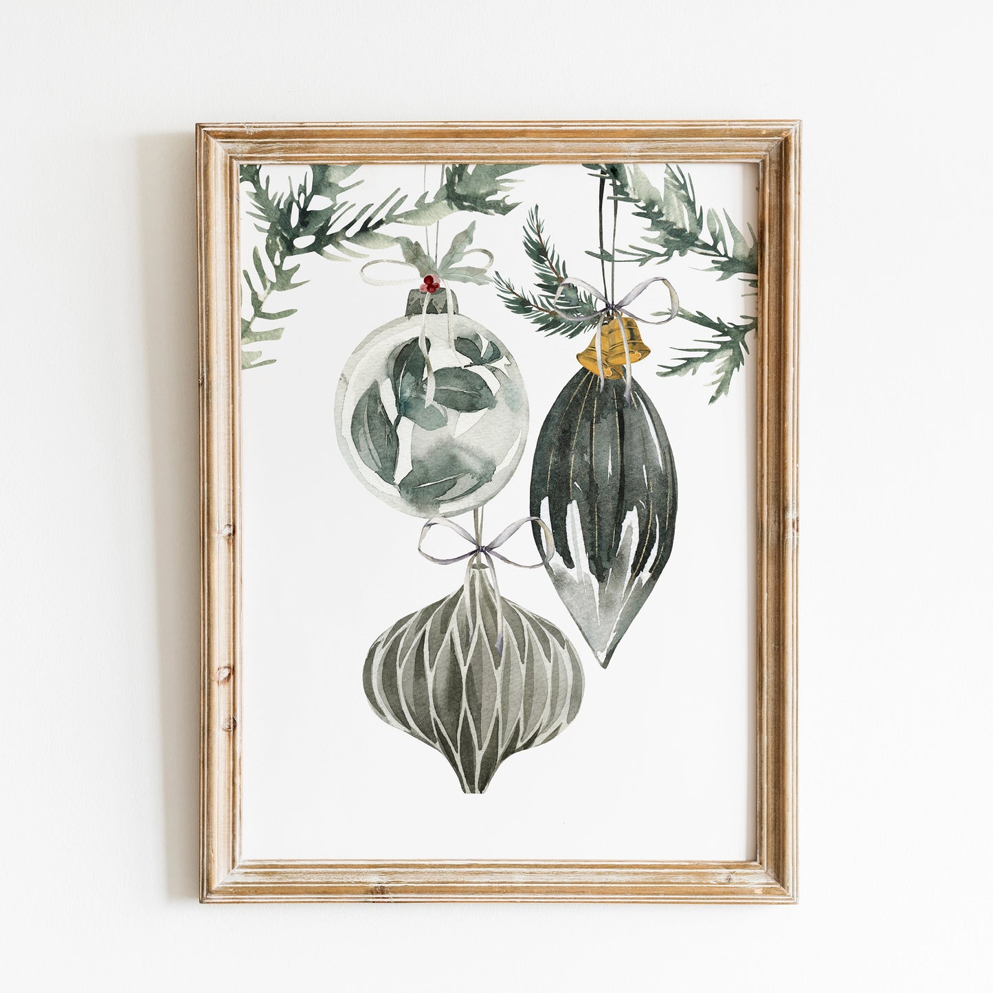 Ornament Christmas art print featuring watercolor Christmas tree ornaments hanging from greenery in a framed artwork.
