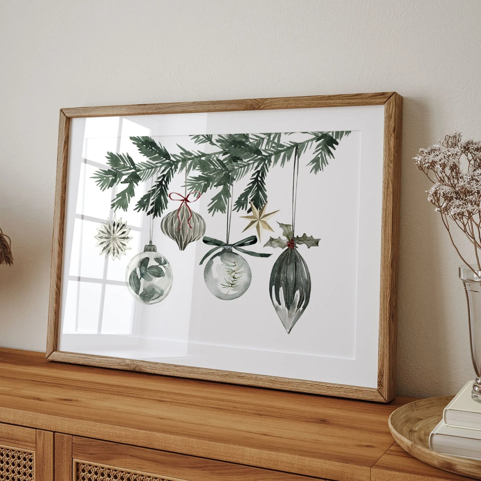 Watercolor Ornaments christmas print art featuring festive decorations hanging from evergreen branches.