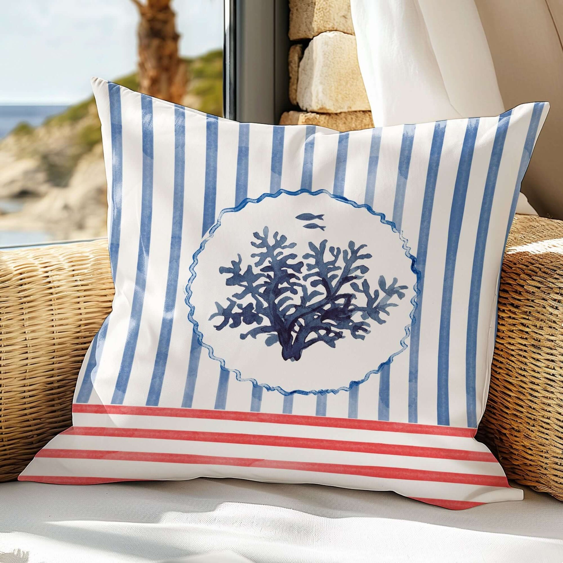 Watercolor Coral and Coastal Stripes Pillow and Cover with blue coral and striped pattern on a cozy chair.