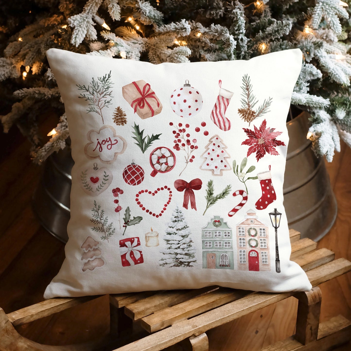 Watercolor Christmas pillow cover under Christmas tree – cozy holiday home decor with red and green cute accents.