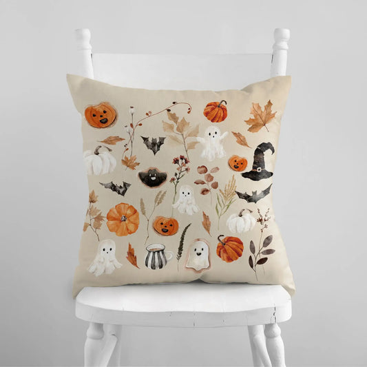 Watercolor Halloween Pillow Covers from Blue Water Songs sitting on white chair