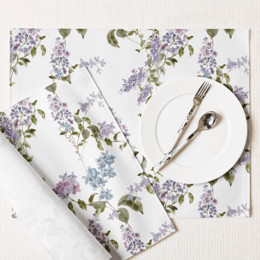 Watercolor Lilac Flower PLACEMAT Set featuring soft lavender and blue floral designs on a stylish table setting.
