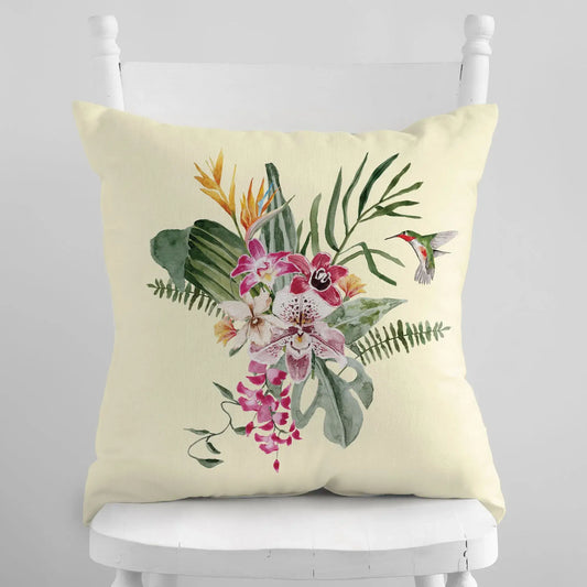 Watercolor Orchid & Hummingbird Pillow showcasing vibrant flowers and tropical leaves on a cream background.