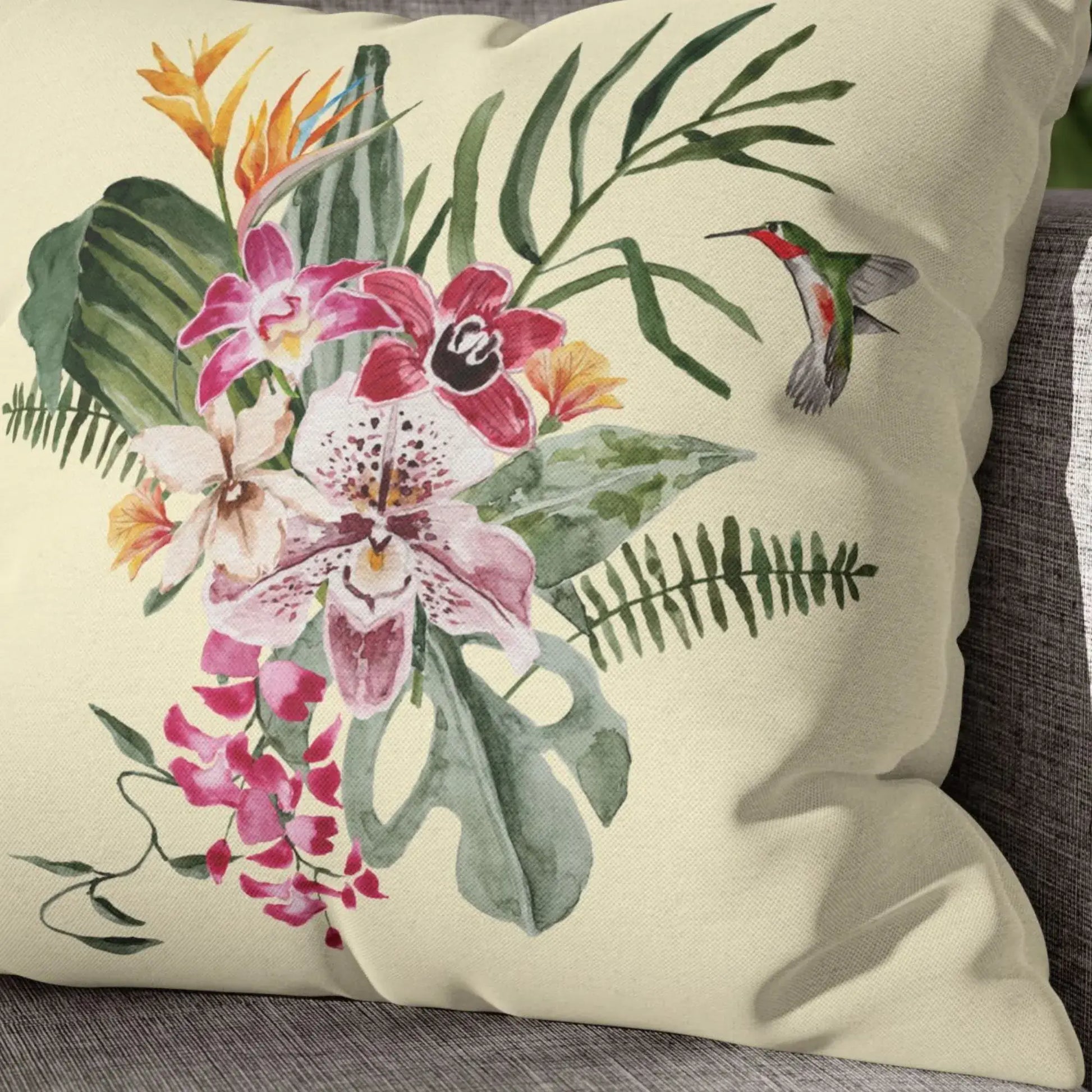 Watercolor Orchid & Hummingbird Pillow featuring vibrant orchids and a hummingbird on a soft cream background.
