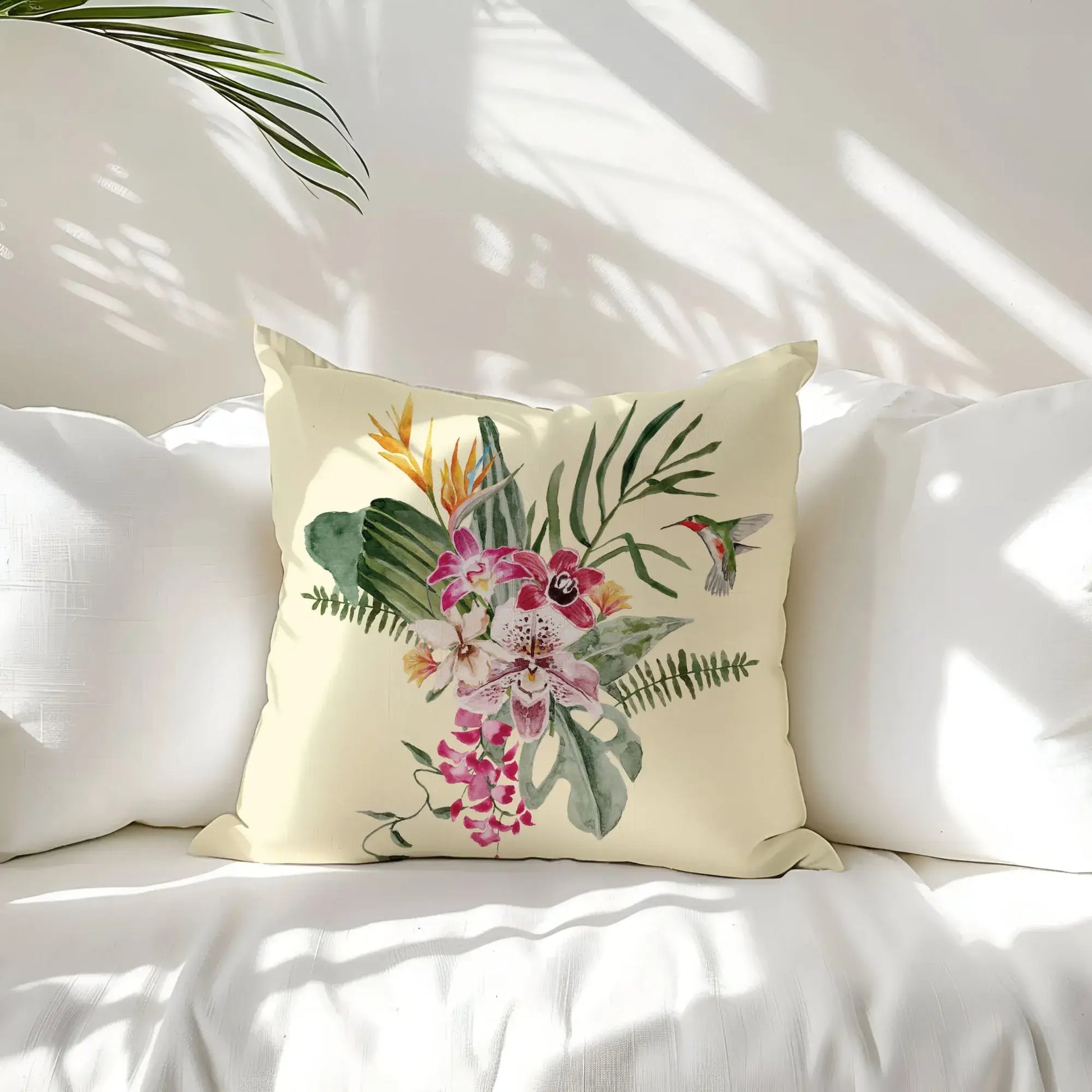 Watercolor Orchid & Hummingbird Pillow showcasing vibrant orchids and a hummingbird on a soft beige background.