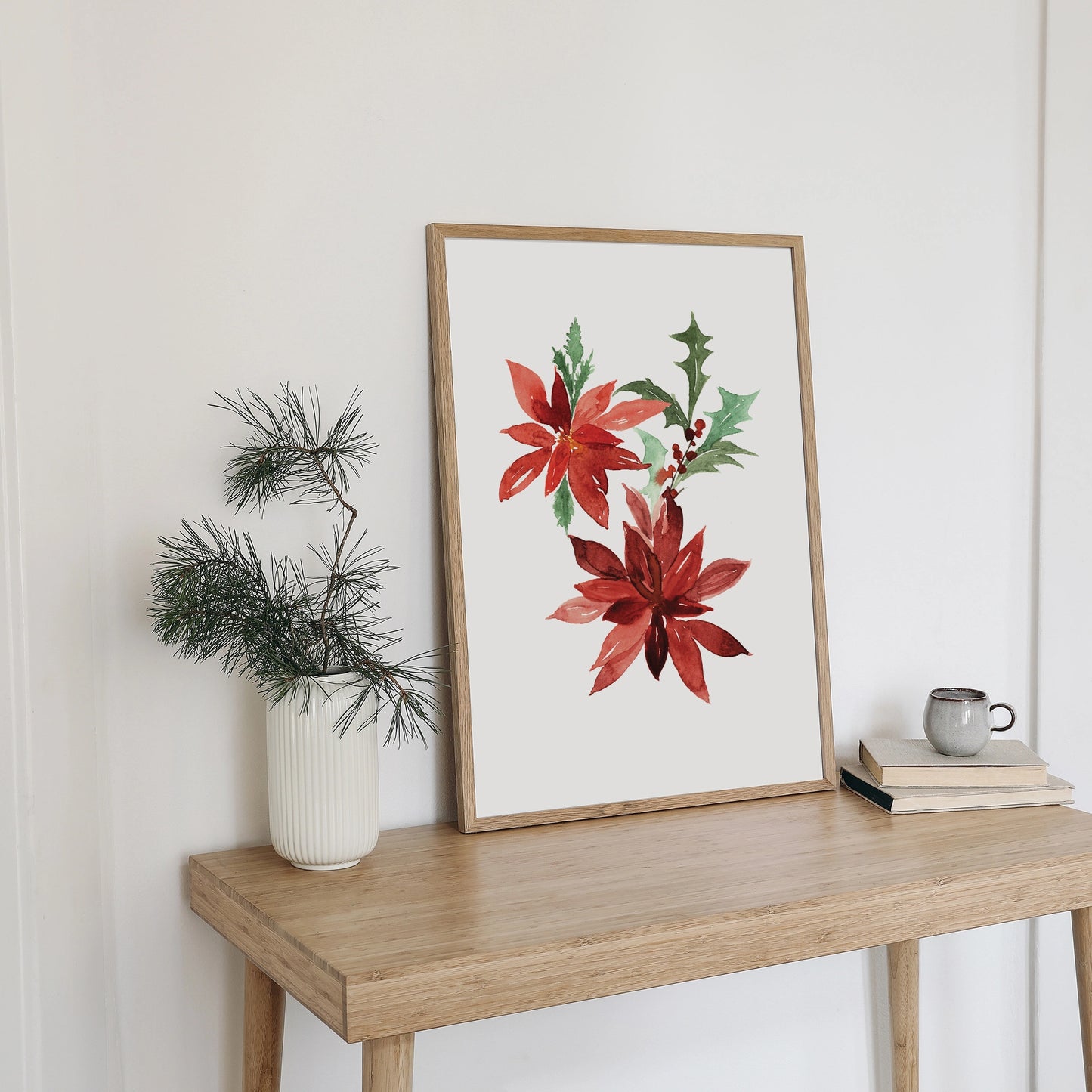 Poinsettia Christmas Art print - DIGITAL DOWNLOAD displayed in a home setting with a plant and decor.