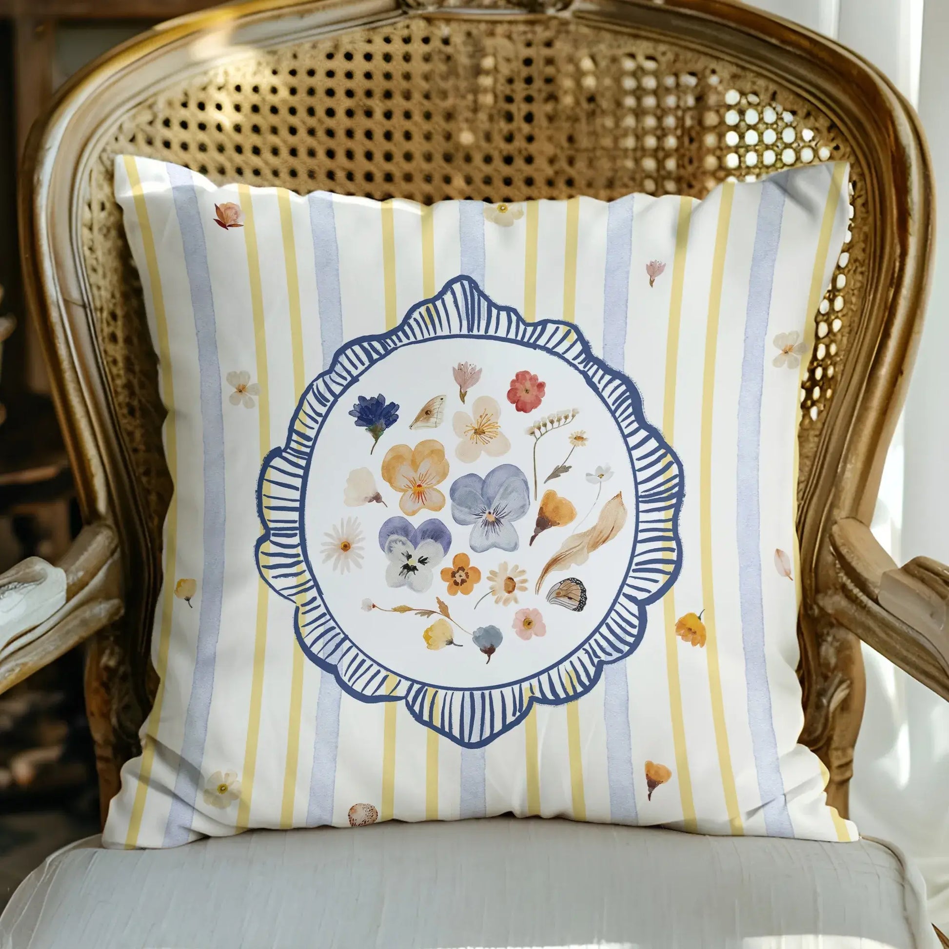 Watercolor Pressed Wildflower Pillow with floral patterns and striped design, adding a fresh touch to home decor.