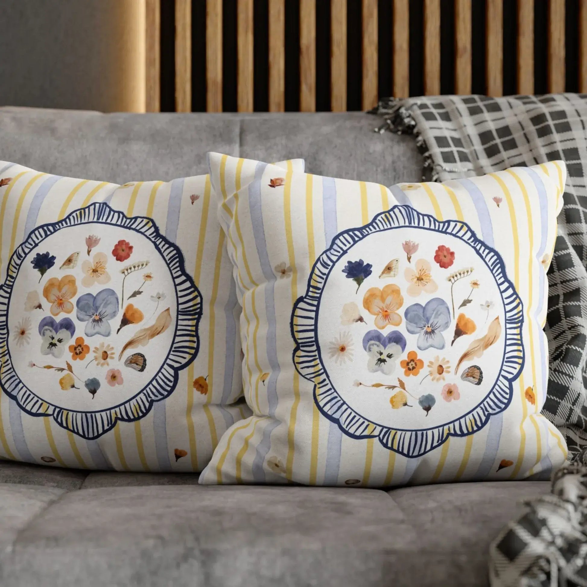 Watercolor Pressed Wildflower Pillow with floral design on striped background, perfect for home decor.