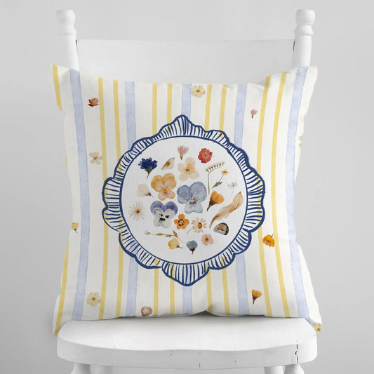 Watercolor Pressed Wildflower Pillow with floral design on a striped background, adding a fresh and bright touch to home decor.