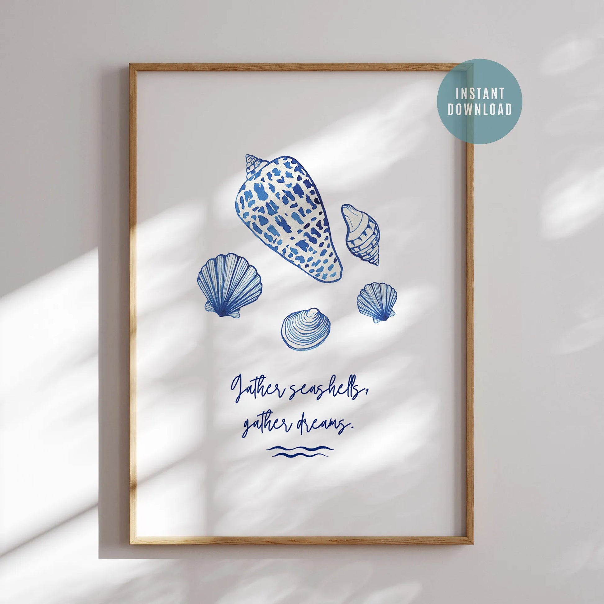 Blue watercolor seashells art print with "Gather seashells, gather dreams" quote, coastal digital download wall art in wooden frame.