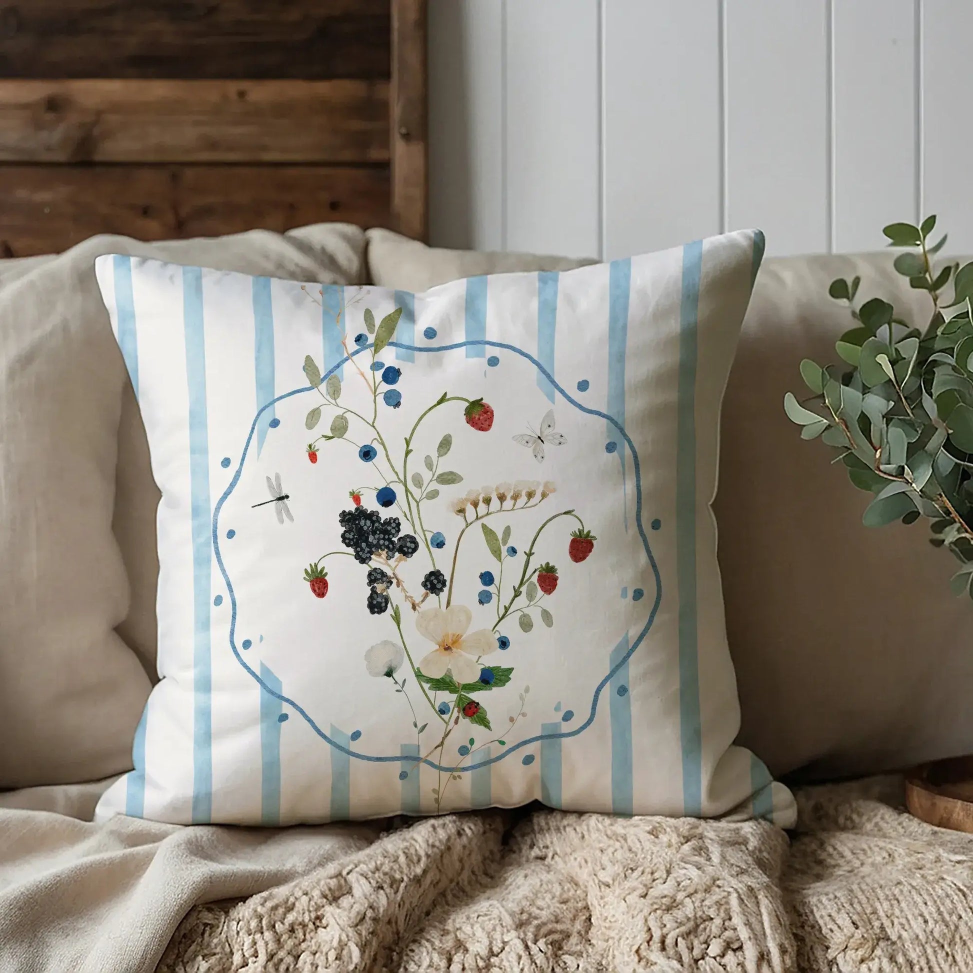 Watercolor Wildflower and Berry Pillow and Cover featuring delicate flowers and berries on a blue striped background.