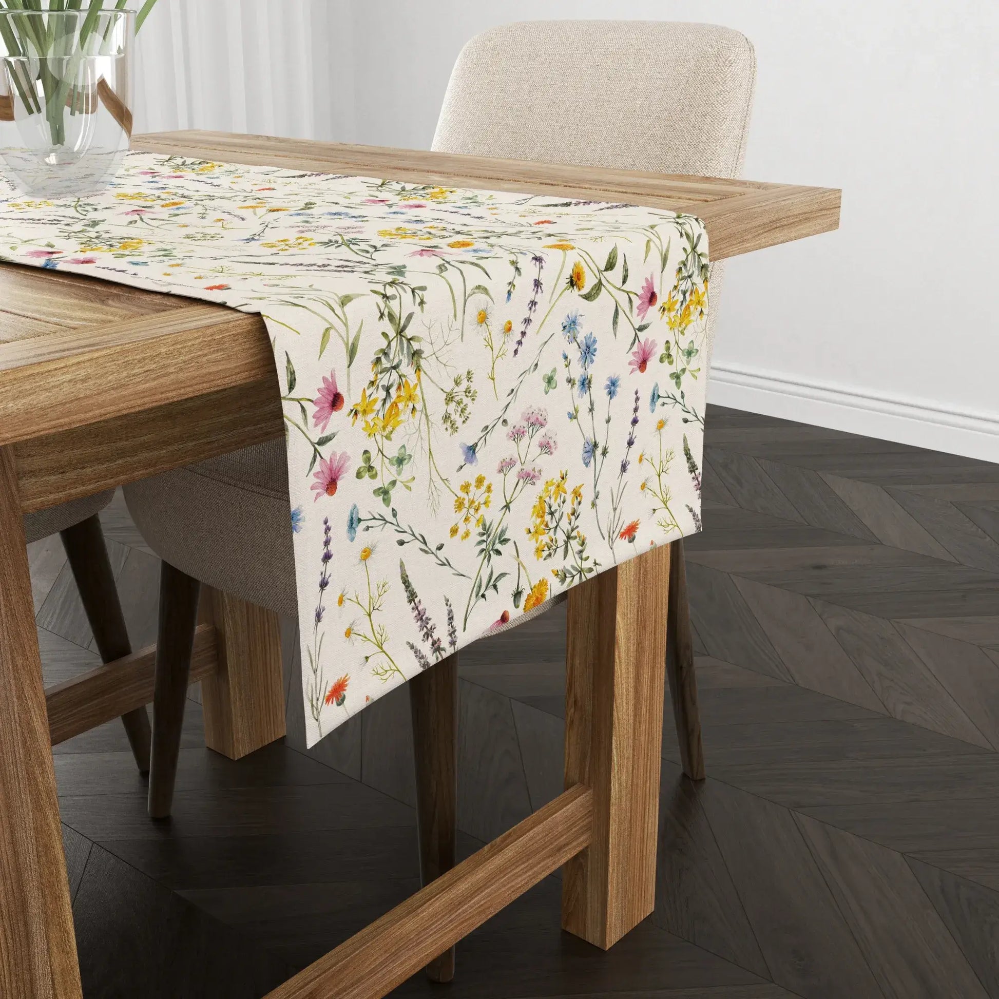 Watercolor Wildflowers Table Runner on a wooden dining table with soft ivory background and colorful floral design.