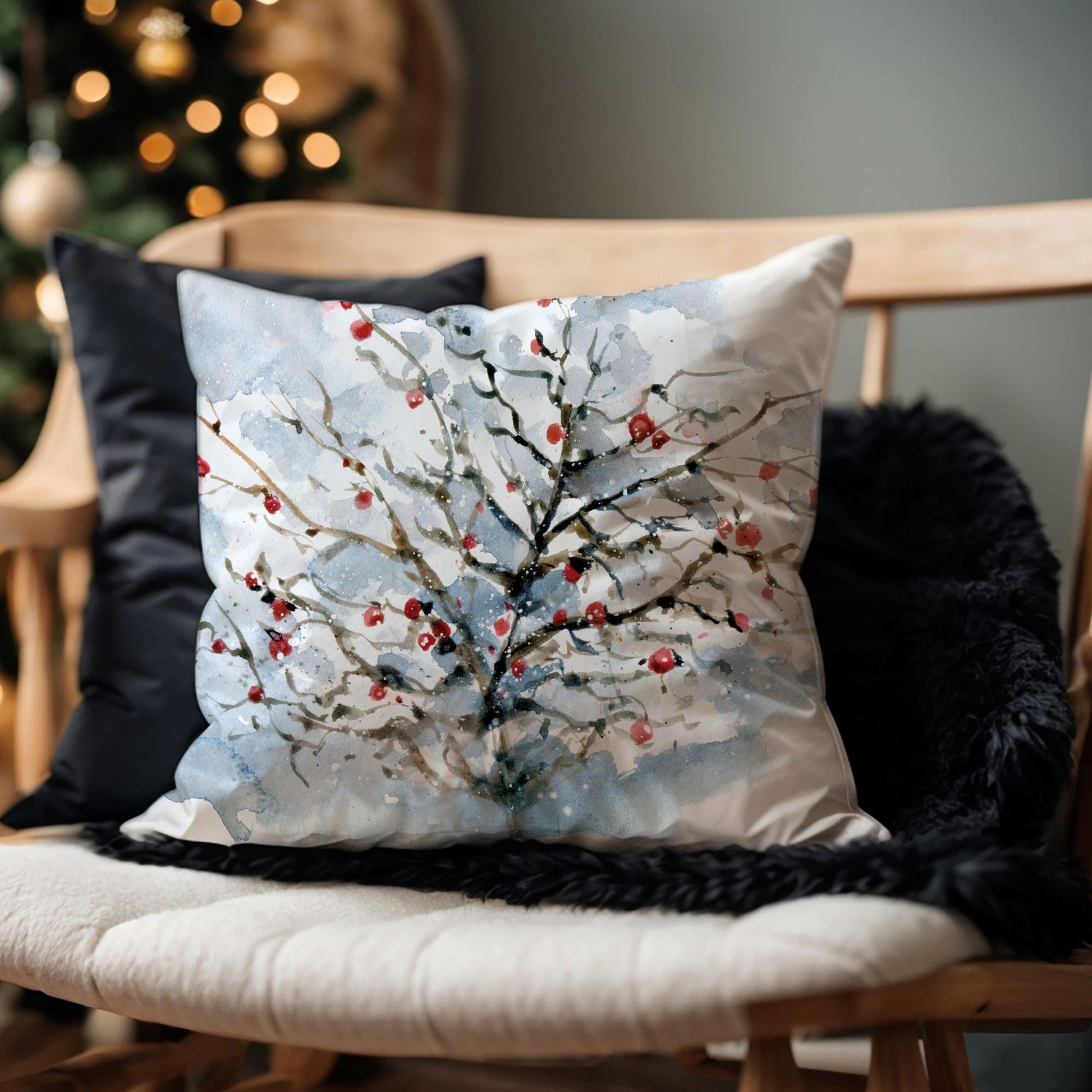 Watercolor winter pillow with snowy tree and red berries on bench – cozy Christmas living room decor