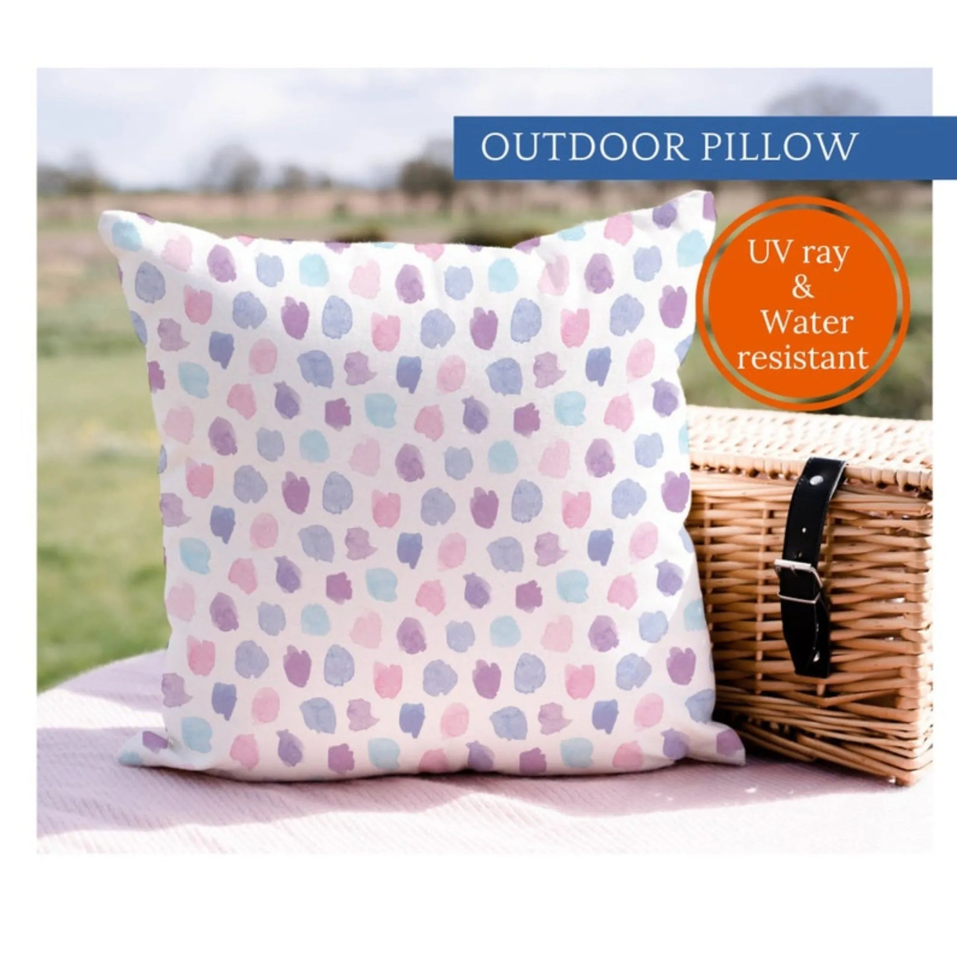 Watercolor Pastel Hand-Painted Pattern| OUTDOOR PILLOW from Blue Water Songs sitting on picnic blanket