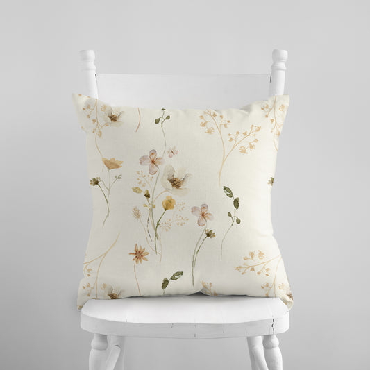 wildflowers throw pillow on white chair