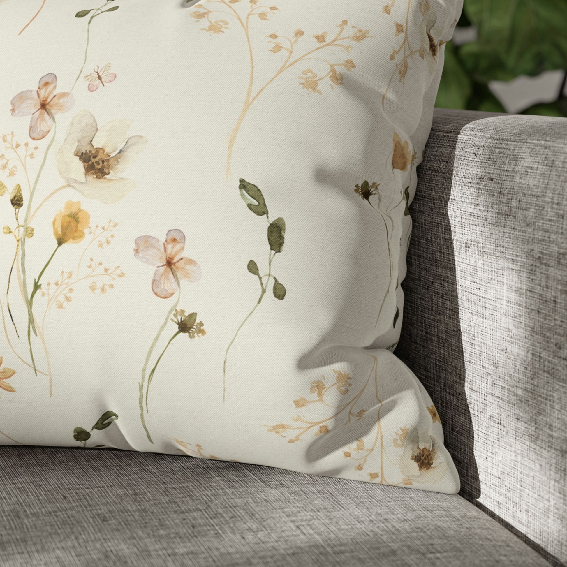 wildflowers throw pillow on grey sofa