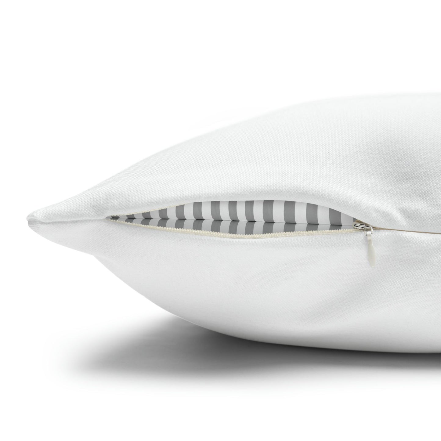 Close-up of white pillow with hidden zipper opening – removable cover with striped insert