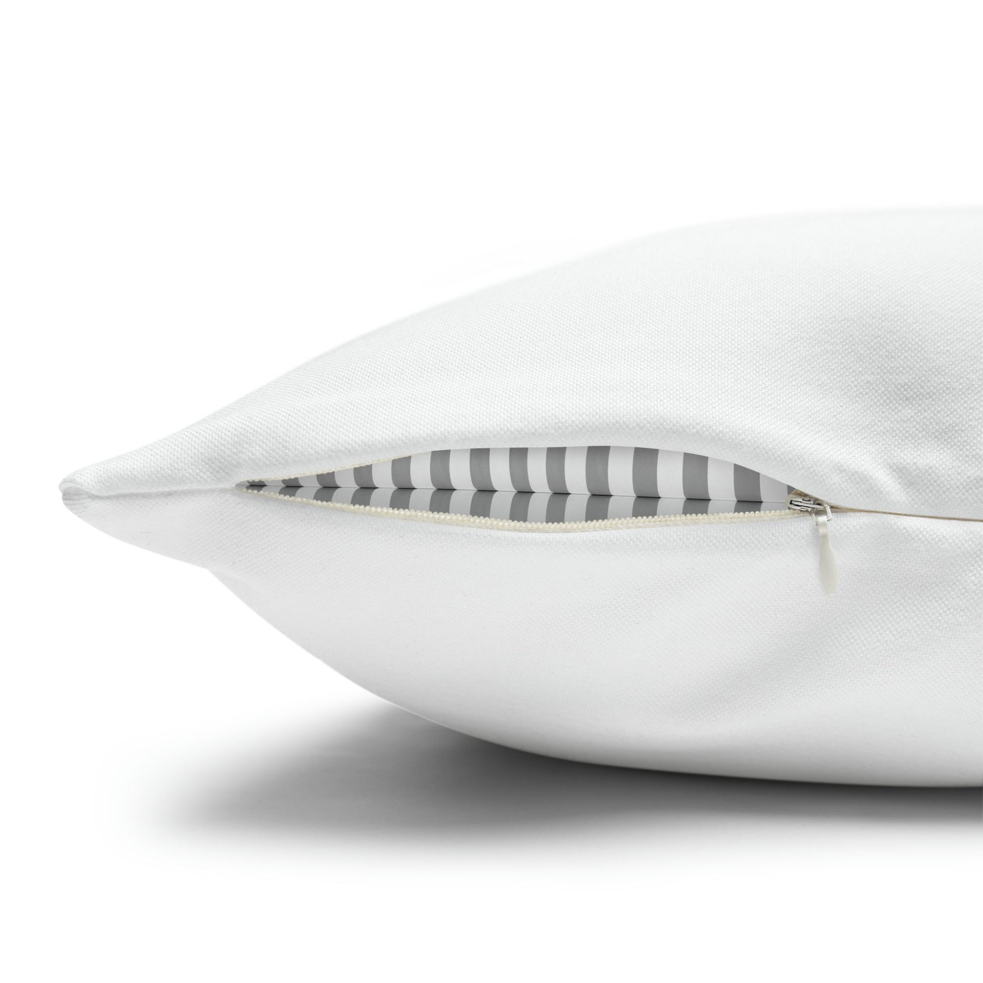 Close-up of white pillow with hidden zipper opening – removable cover with striped insert