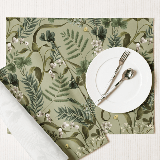 Wild Fern Garden Placemats set on a table with white dinnerware and botanical design, ideal for nature-themed dining.