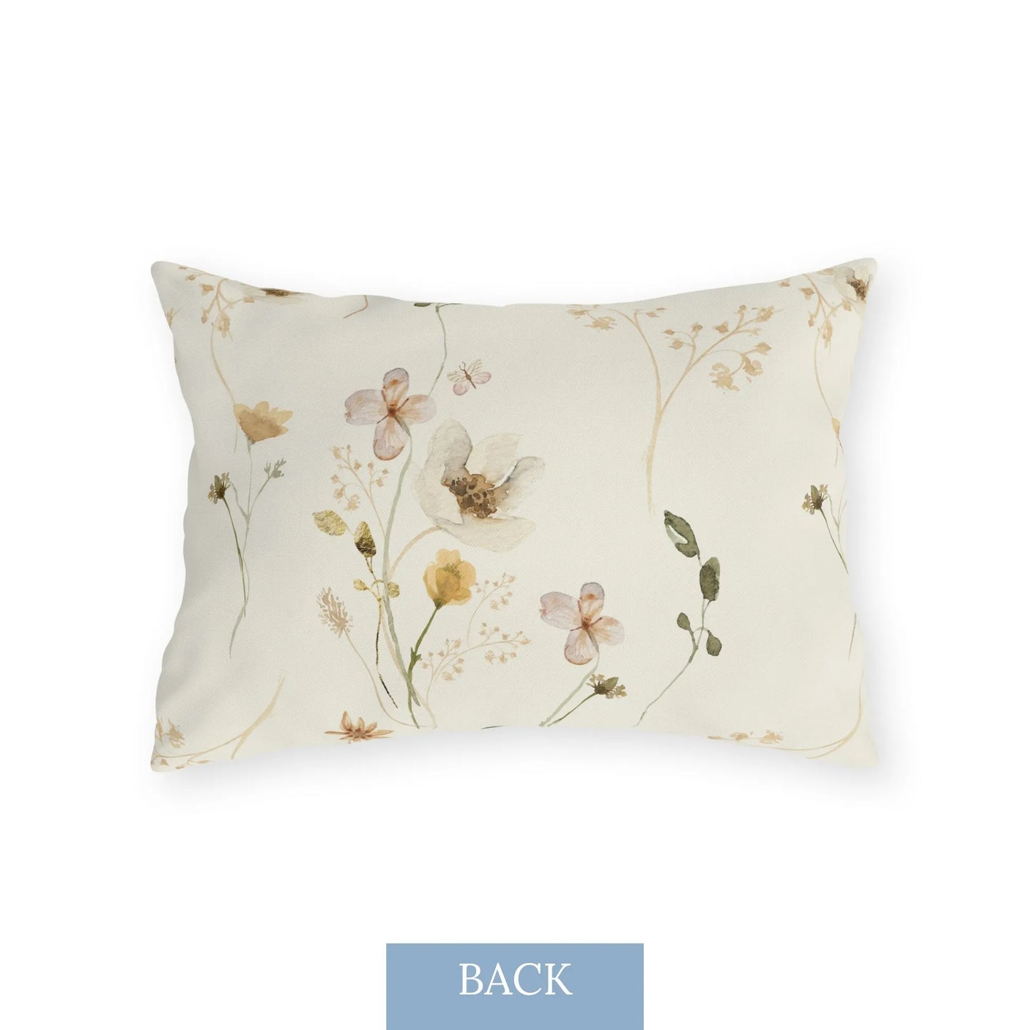 Back of lumbar pillow with pastel wildflowers and watercolor details in soft blue and peach tones