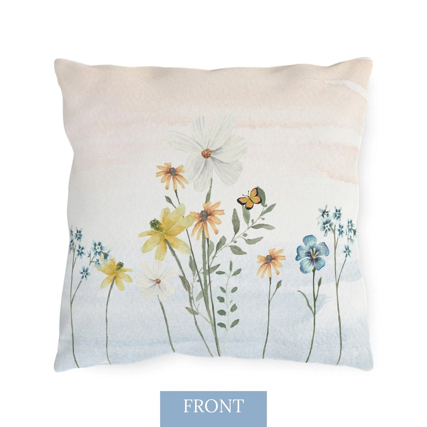 Front view of nature-inspired outdoor pillow with watercolor wildflowers and butterflies in soft pastel tones, perfect for botanical decor.