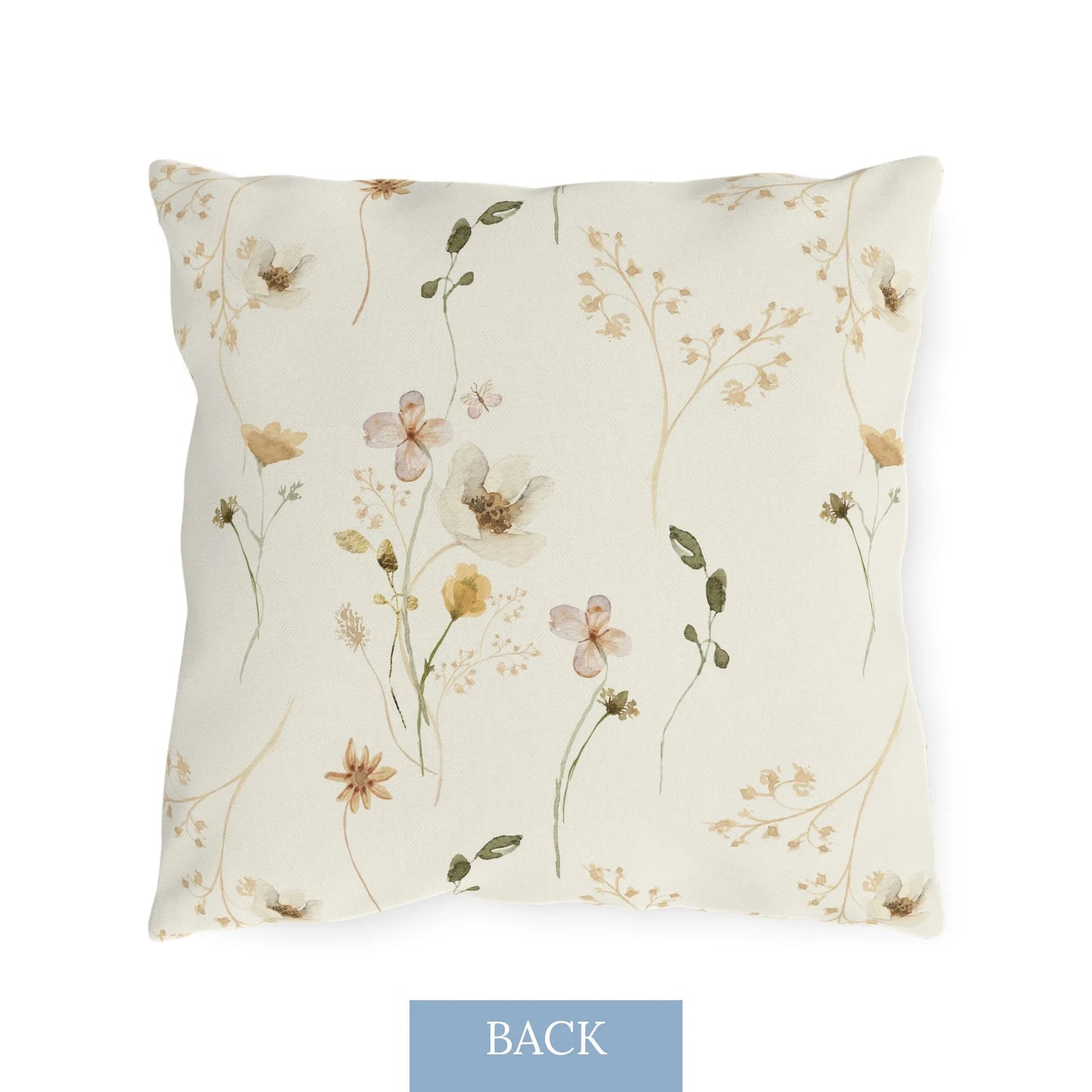 Back of the pillow featuring soft blue and yellow wildflowers on a light watercolor background