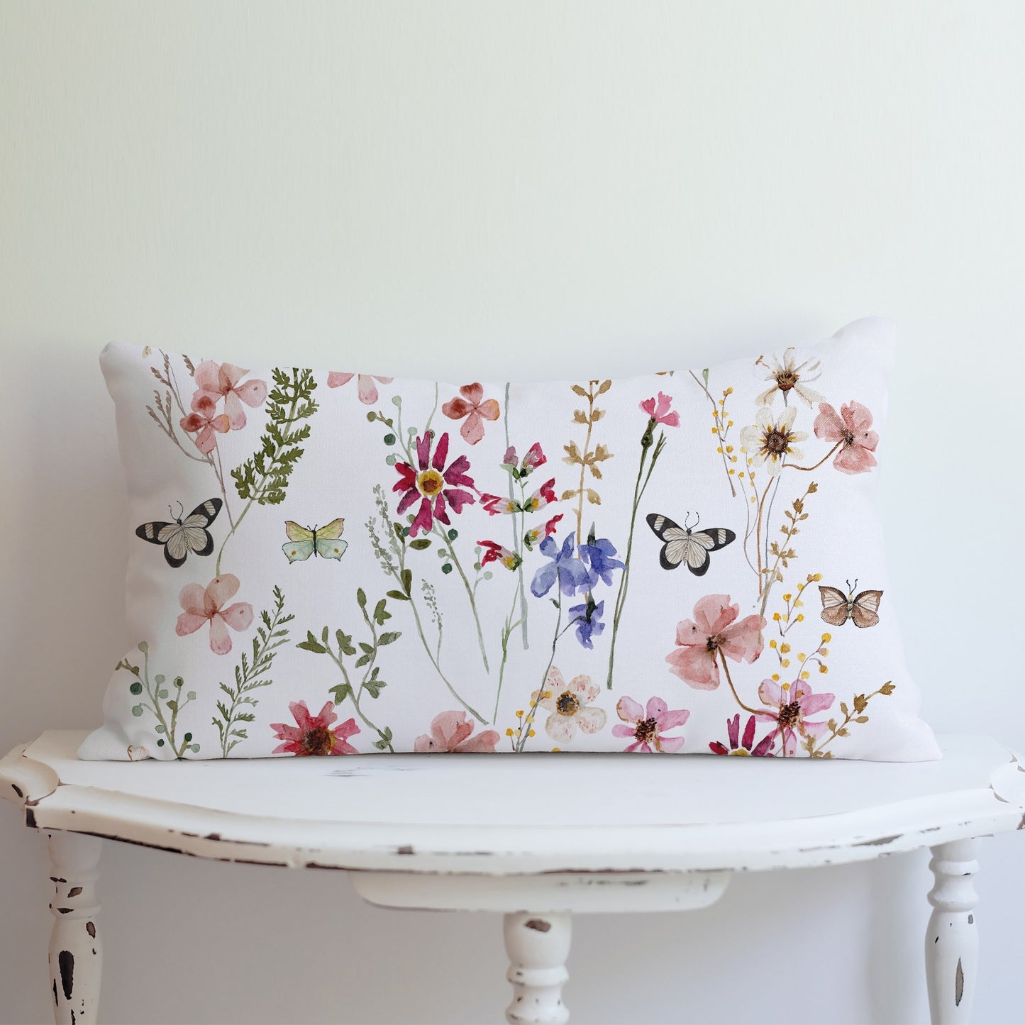 Watercolor Butterflies Wildflowers lumbar PILLOW from Blue Water Songs on vintage table