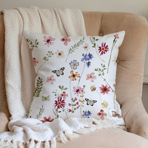 Watercolor Butterflies Wildflowers PILLOW & COVER from Blue Water Songs on pink sofa