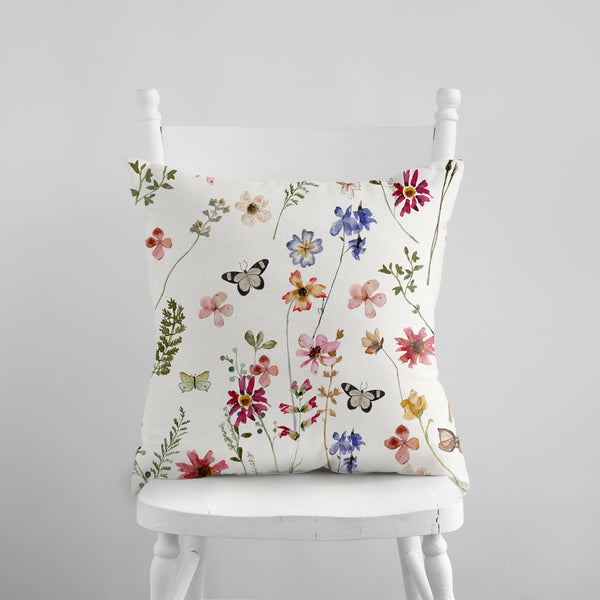 Watercolor Butterflies Wildflowers PILLOW & COVER from Blue Water Songs on white chair