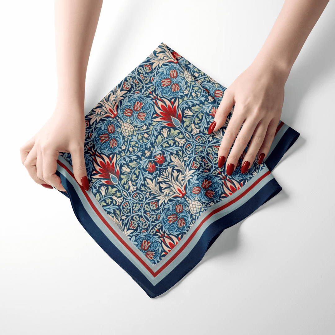 William Morris Scarf Snakehead shown in close-up with intricate floral pattern and contrasting navy border.