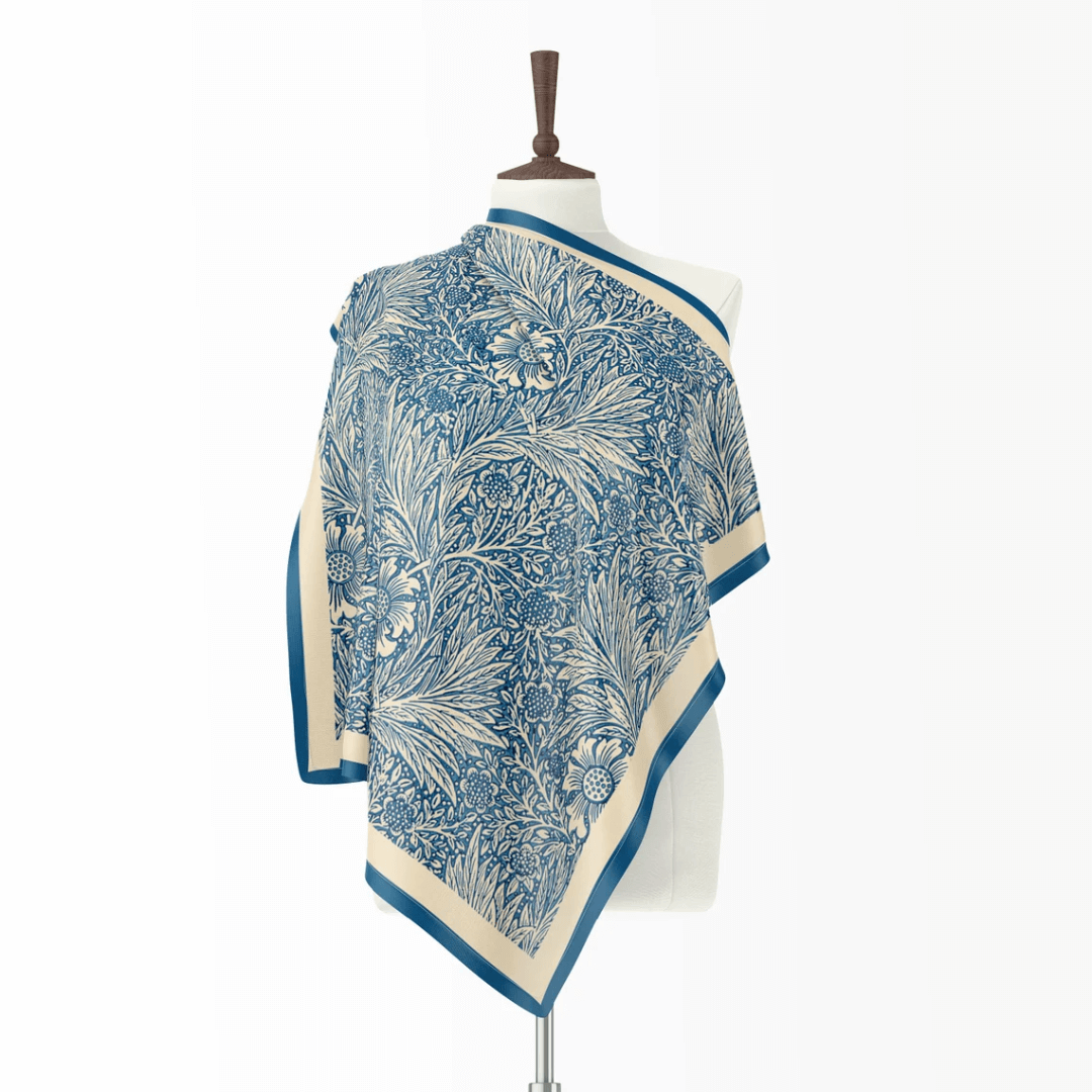 William Morris silk scarf blue floral showcasing marigold pattern on a mannequin for elegant fashion.