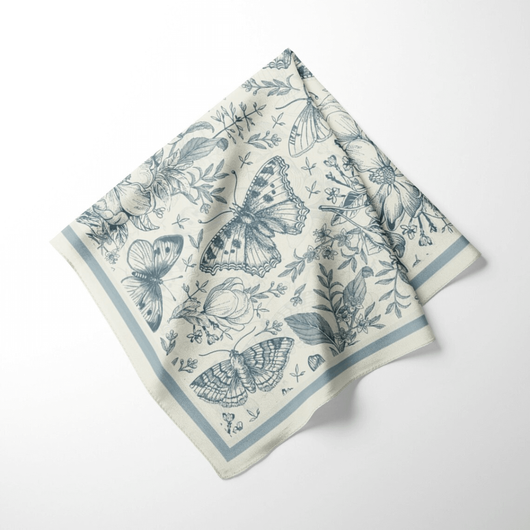 William Morris Silk Scarf Blue Moth featuring butterflies and florals in soft blue tones.