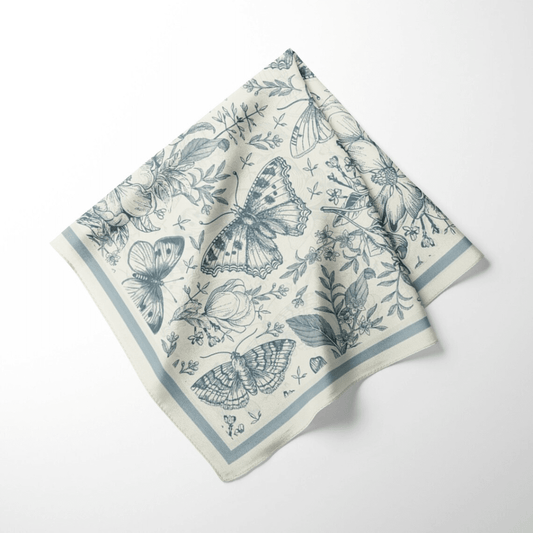 William Morris Silk Scarf Blue Moth featuring butterflies and florals in soft blue tones.