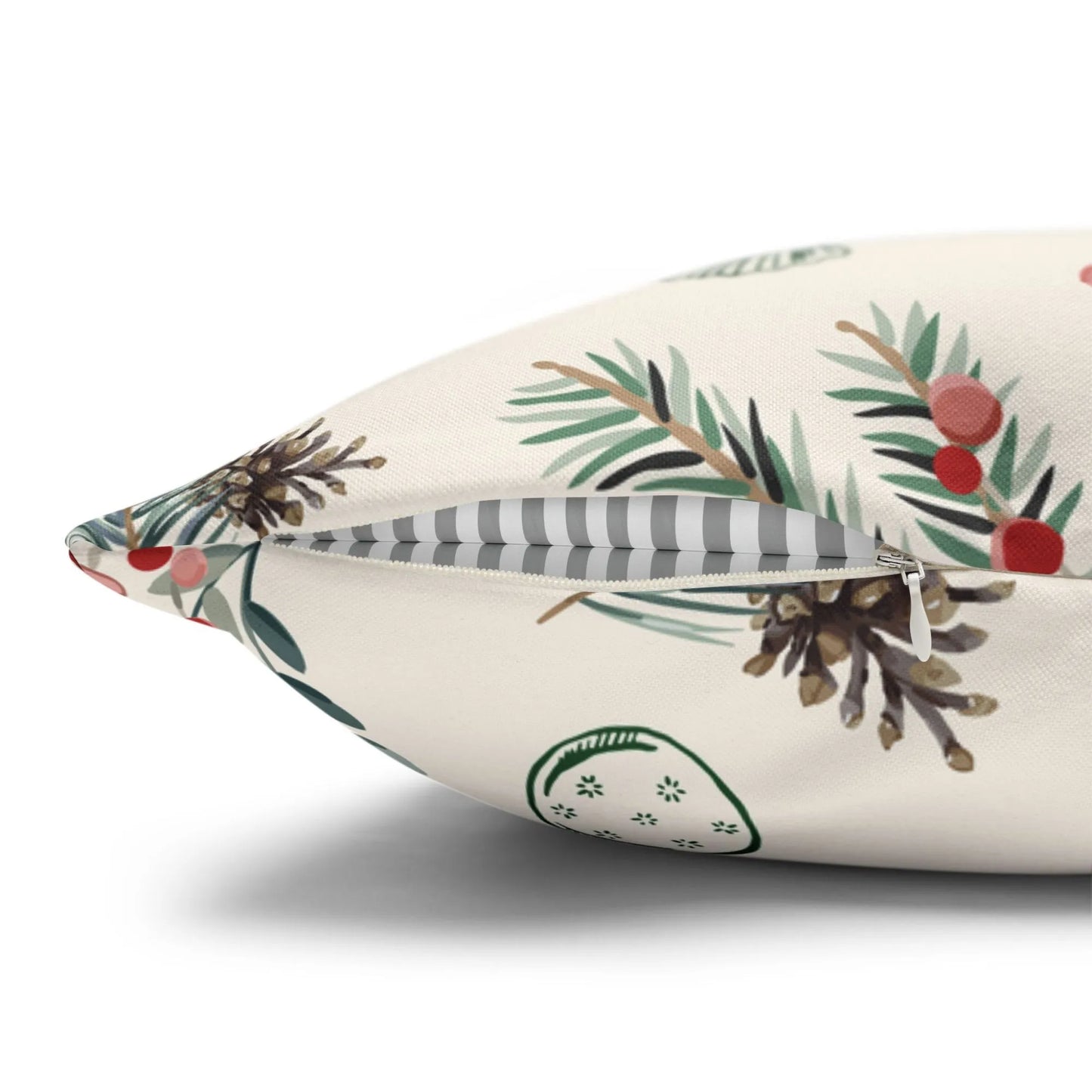 Winter berry Christmas pillow cover showcasing detailed pine branches and red berries on a soft fabric background.