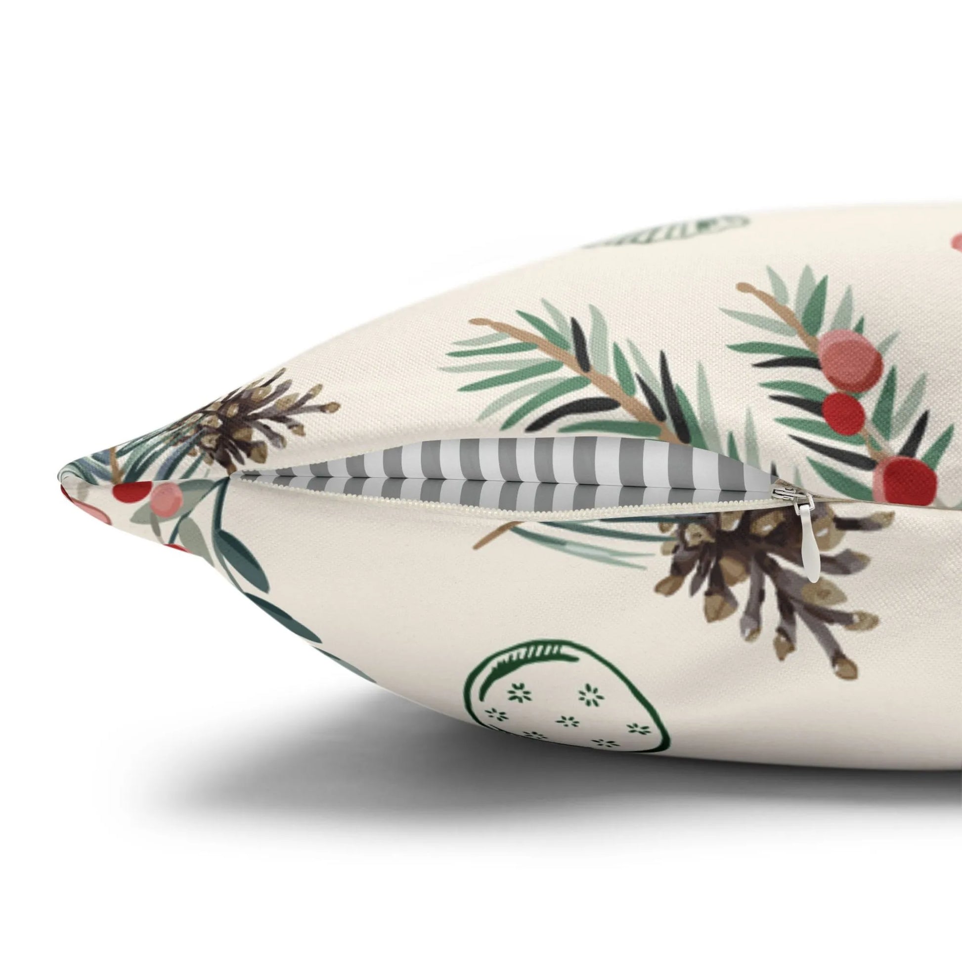 Winter berry Christmas pillow cover showcasing detailed pine branches and red berries on a soft fabric background.