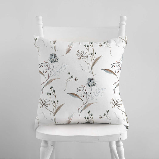 Winter botanical christmas pillow with watercolor floral design on a white background, adding seasonal elegance to your home decor.
