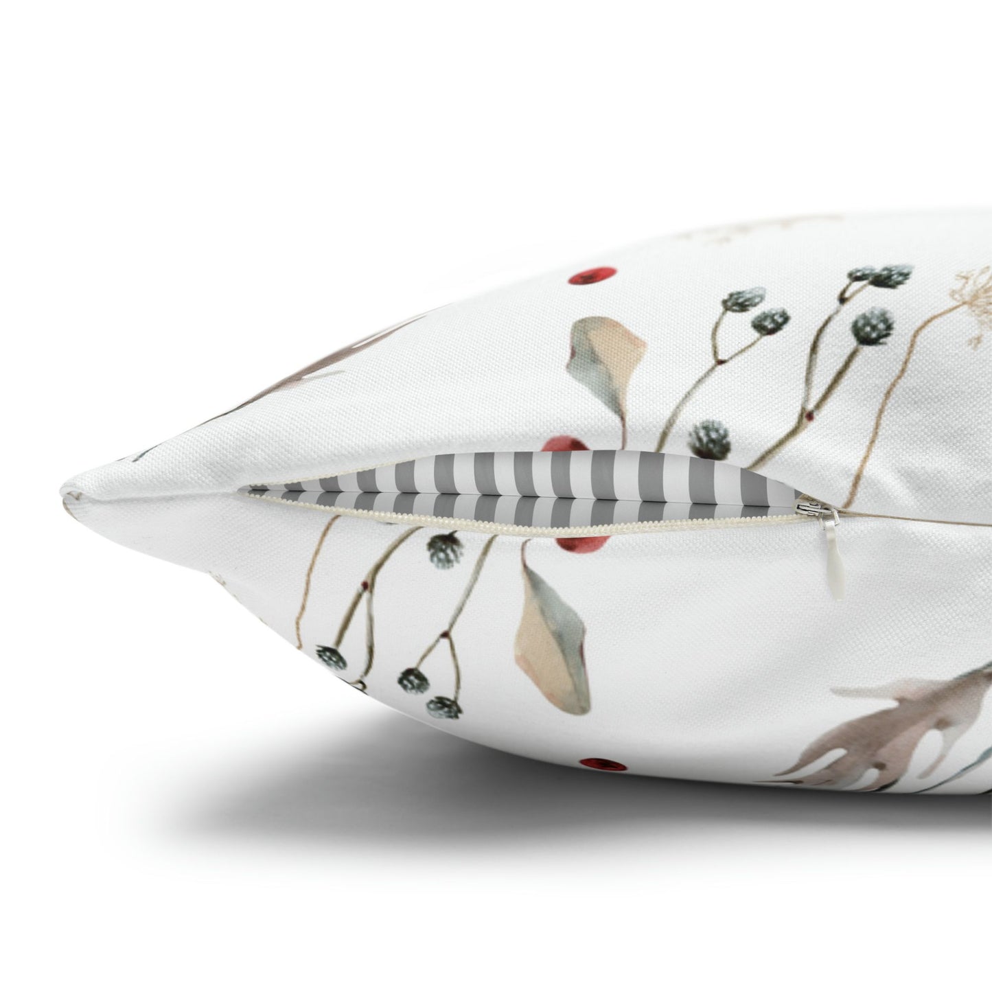 Close-up of winter botanical pillow cover with hidden zipper and red berries detail