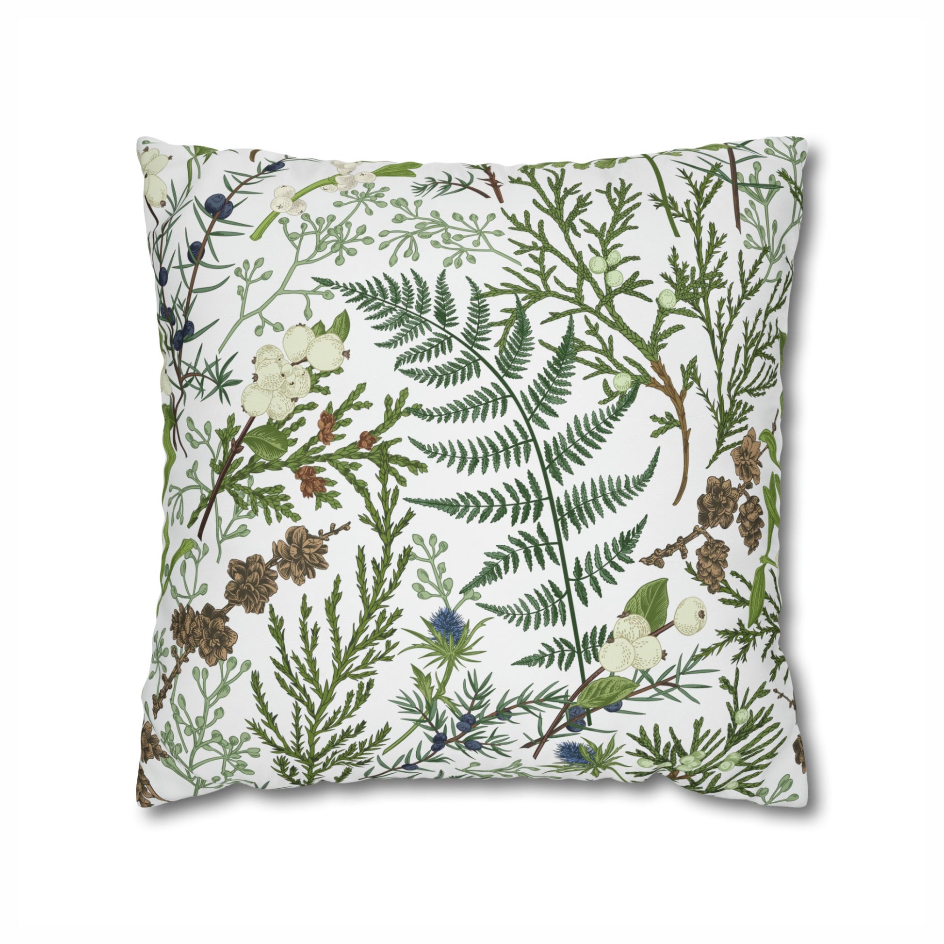 Winter botanical pillow with green fern, pinecones, and mistletoe on white background – nature-inspired cushion