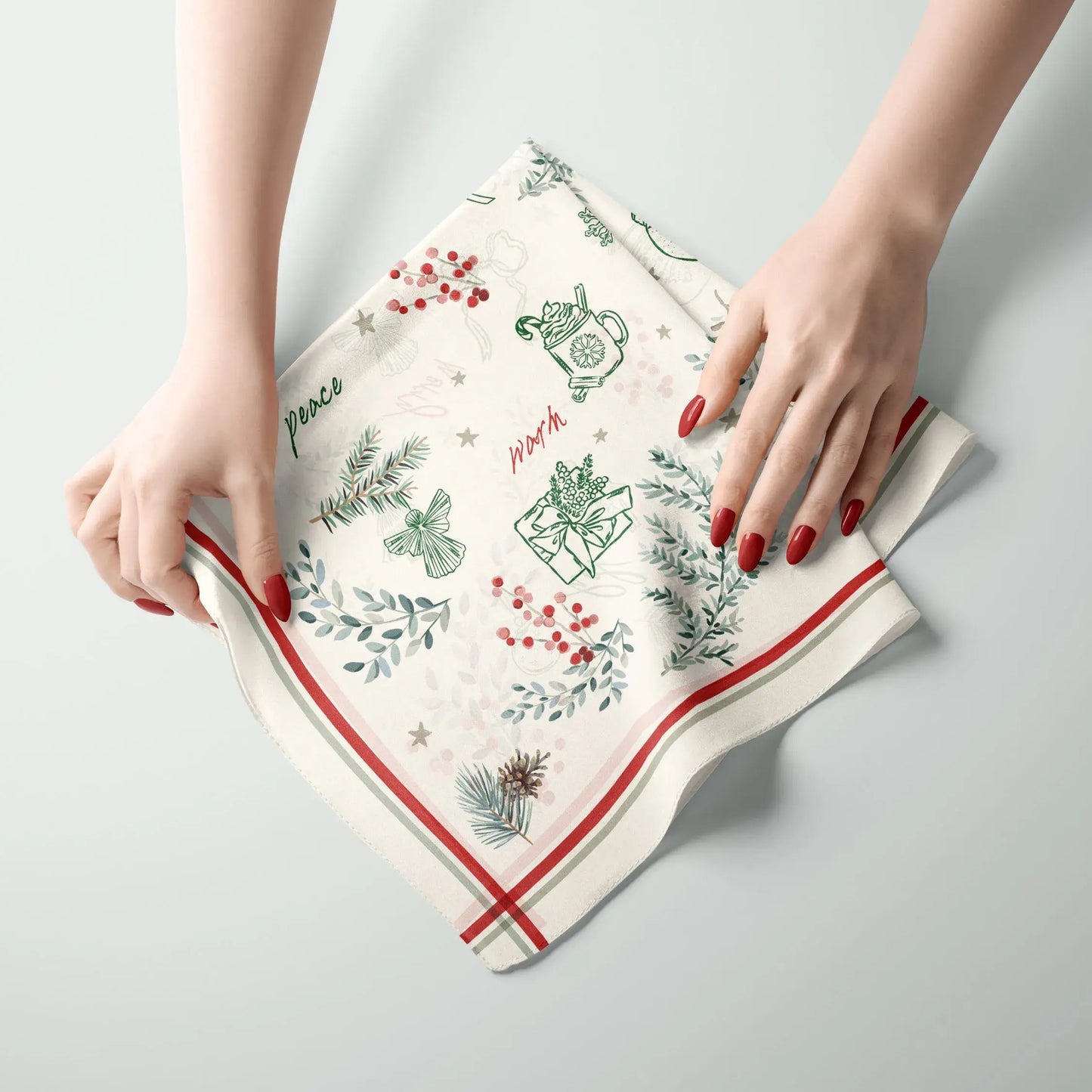 Winter Botanical Scarf with pine and red berry prints, personalized Christmas gift on a light background.