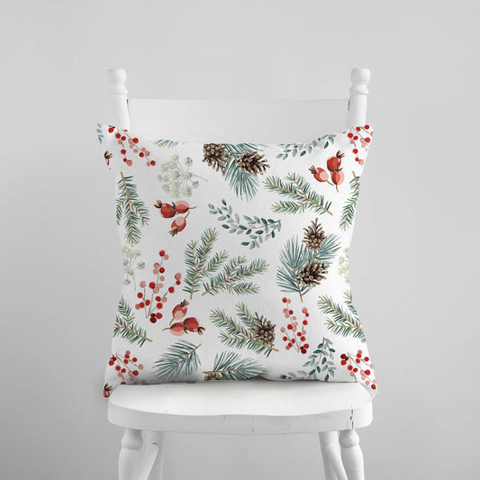 white chair with a Red Berry and Winter Botanical PILLOW from Blue Water Songs on it