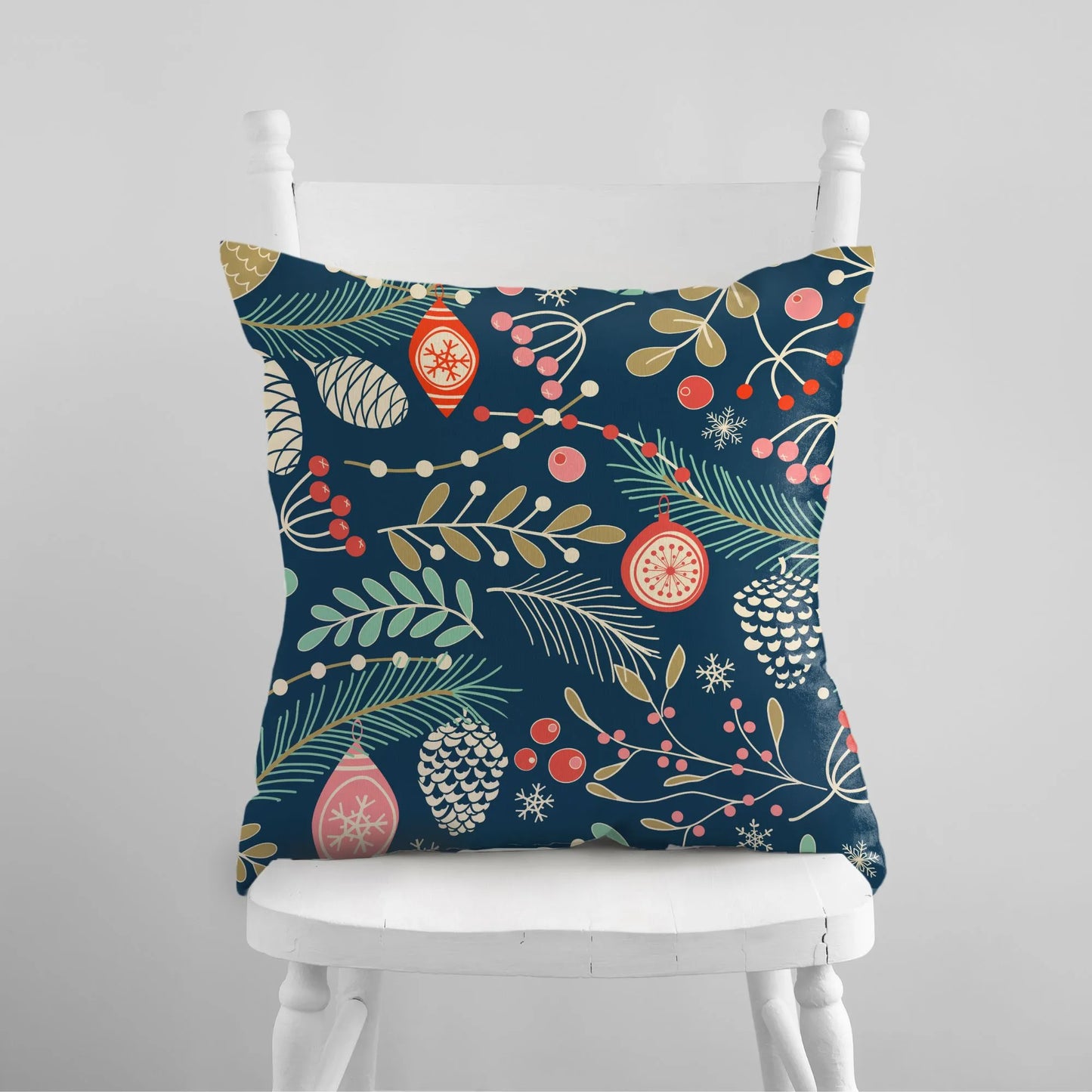 Winter Botanical Pillow from Blue Water Songs sitting on white chair