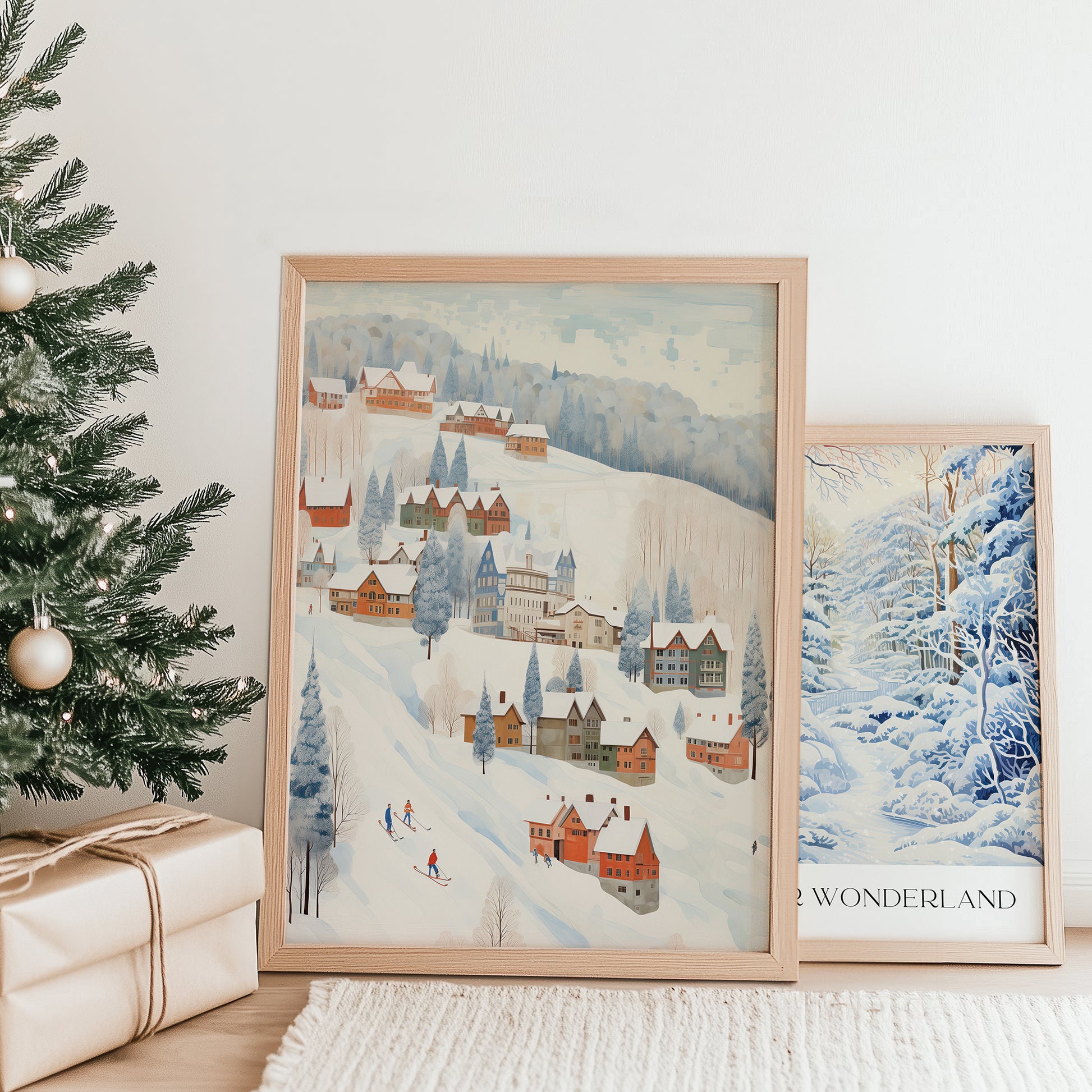 Winter Village posters from Blue Water Songs next to christmas tree and gifts