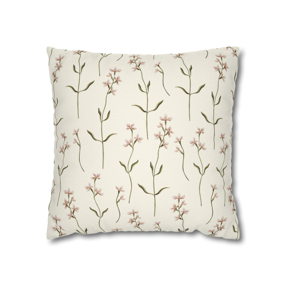 a white pillow with pink flowers on it