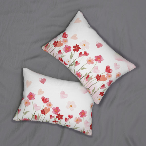 two pillows with hearts and flowers on them