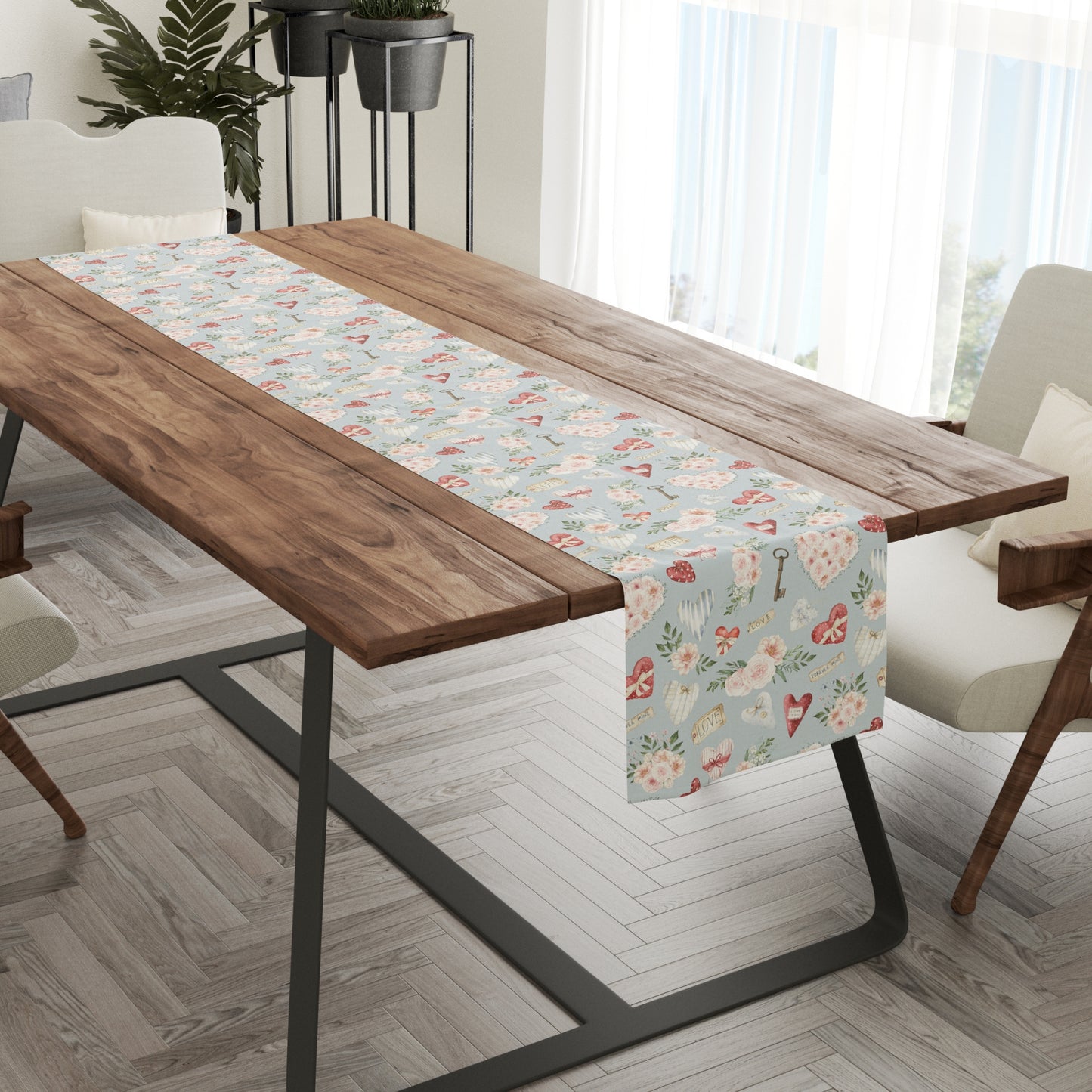 a wooden table with a floral table runner on it