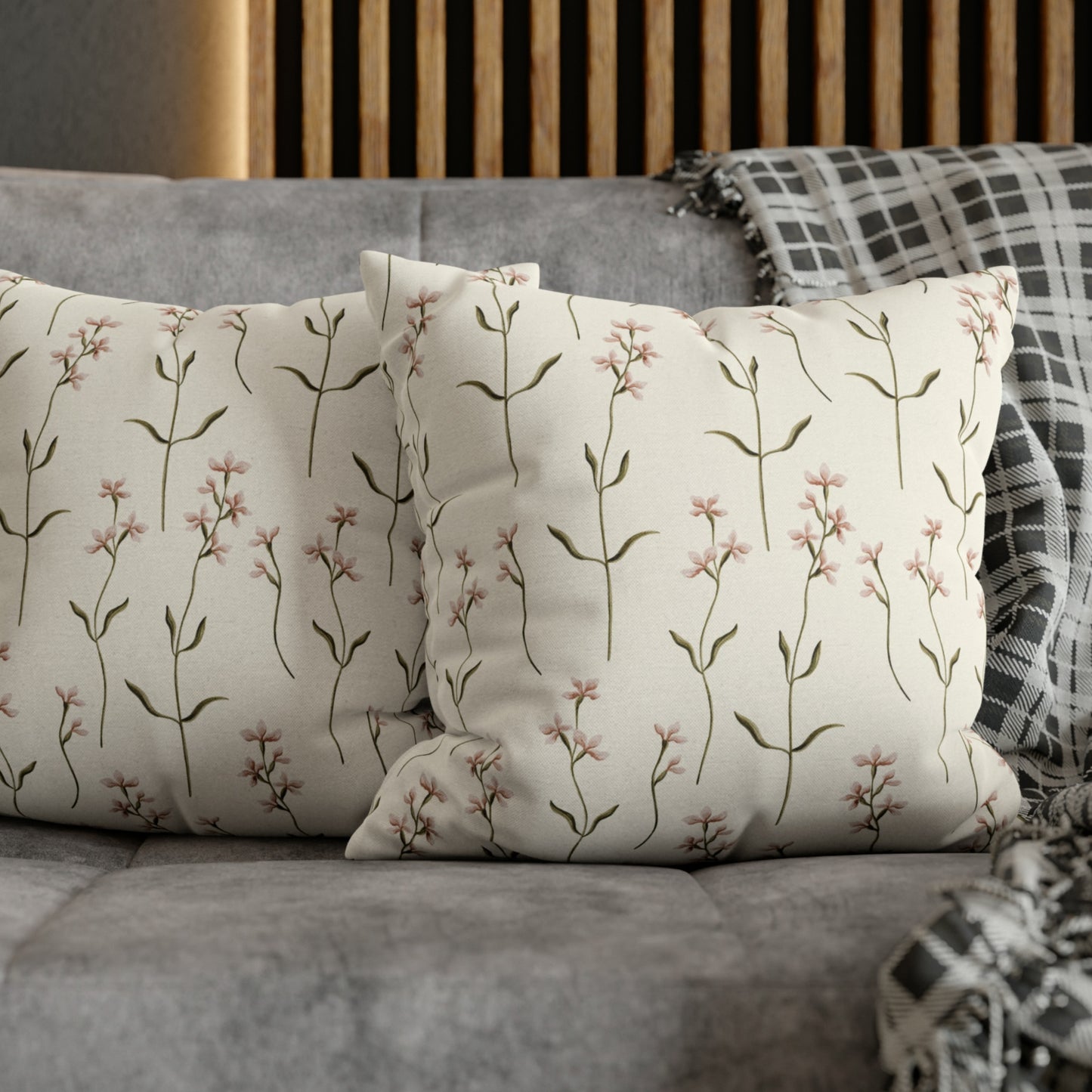 a close up of two pillows on a couch