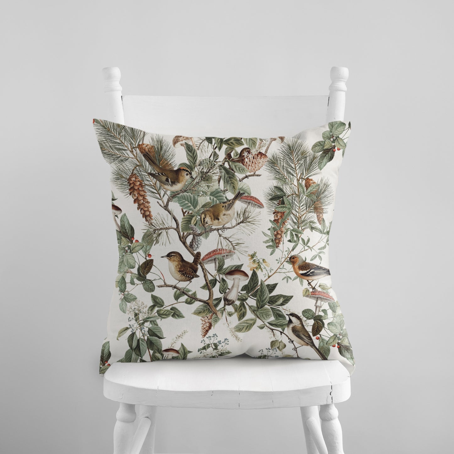 a white chair with a pillow on top of it